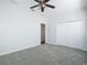 Simple bedroom with ceiling fan, neutral walls, and carpet flooring at 4440 Tatum St, Port Charlotte, FL 33948