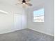 Spacious bedroom with ceiling fan and window at 4440 Tatum St, Port Charlotte, FL 33948