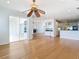 Open living area with hardwood floors, and views to kitchen and pool at 4440 Tatum St, Port Charlotte, FL 33948