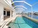 Enclosed pool and spa with canal views at 4440 Tatum St, Port Charlotte, FL 33948