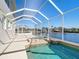 Relaxing pool and spa with canal views at 4440 Tatum St, Port Charlotte, FL 33948