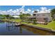 Waterfront home showcasing pool, dock, and canal views at 4440 Tatum St, Port Charlotte, FL 33948