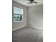 Bright bedroom with window and carpet flooring at 16721 Barnwood Pl, Bradenton, FL 34211