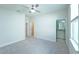 Bedroom with ceiling fan and access to bathroom at 16721 Barnwood Pl, Bradenton, FL 34211