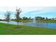 Serene community lake with a water fountain at 16721 Barnwood Pl, Bradenton, FL 34211