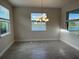 Bright dining room with chandelier and view of water at 16721 Barnwood Pl, Bradenton, FL 34211