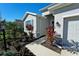 Two-story house with gray siding, landscaping, and a two-car garage at 16721 Barnwood Pl, Bradenton, FL 34211