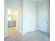 Hallway with bathroom and bedroom access at 16721 Barnwood Pl, Bradenton, FL 34211