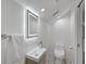 Bathroom featuring modern sink with LED mirror and toilet at 5373 Dominica Cir, Sarasota, FL 34233