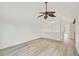 Spacious room featuring wood floors and natural light, with staircase in view at 5373 Dominica Cir, Sarasota, FL 34233