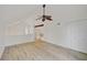 Spacious room featuring wood floors and natural light, with staircase in view at 5373 Dominica Cir, Sarasota, FL 34233