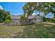 Charming one-story home featuring a beautiful yard with mature trees and lush landscaping at 5373 Dominica Cir, Sarasota, FL 34233