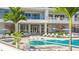 Resort-style pool and deck area with lounge chairs and umbrellas at 555 Quay Cmn # 301, Sarasota, FL 34236