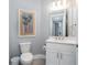 Clean and modern half bathroom with white vanity and updated fixtures at 7840 34Th W Ave # 103, Bradenton, FL 34209