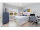 Comfortable bedroom with a queen bed and built-in workspace at 7840 34Th W Ave # 103, Bradenton, FL 34209