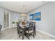 Dining room with dark wood table and chairs, artwork at 7840 34Th W Ave # 103, Bradenton, FL 34209