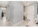 Gray hallway with tiled floor and access to other rooms at 7840 34Th W Ave # 103, Bradenton, FL 34209