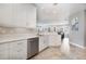 White kitchen with stainless steel appliances and granite countertops at 7840 34Th W Ave # 103, Bradenton, FL 34209