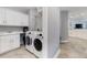 Convenient laundry room with washer, dryer, and storage cabinets at 7840 34Th W Ave # 103, Bradenton, FL 34209