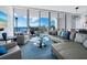 Modern living room with sectional sofa and stunning water views at 1155 N Gulfstream Ave # 703, Sarasota, FL 34236