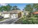 Front view of charming house with a two-car garage at 128 51St Street E Cir # 7, Palmetto, FL 34221