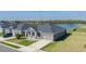 Single-story house with a view of the pond and neighborhood at 16128 67Th E Ct, Parrish, FL 34219