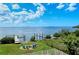 Private backyard with fire pit, seating, and waterfront access at 2412 Bay Dr W Ave, Bradenton, FL 34207