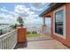 Private balcony overlooking the water with a hammock and chairs at 2412 Bay Dr W Ave, Bradenton, FL 34207