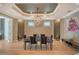 Formal dining room with a chandelier and seating for six at 2412 Bay Dr W Ave, Bradenton, FL 34207