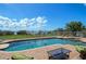 Expansive pool with patio furniture and stunning water views at 2412 Bay Dr W Ave, Bradenton, FL 34207