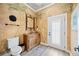 Unique half bathroom with custom painted palm trees and granite countertop at 401 Walls Way, Osprey, FL 34229