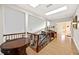 Open hallway with wooden railings and a view of the home's interior, creating a grand entrance at 401 Walls Way, Osprey, FL 34229