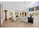 Bright living room area with hardwood floors, modern lighting, and a vaulted ceiling at 401 Walls Way, Osprey, FL 34229