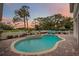 Inviting kidney-shaped pool with patio and sunset view at 401 Walls Way, Osprey, FL 34229