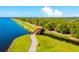 Aerial view of a walking path and bridge by the lake at 4990 Baraldi Cir # 101, Sarasota, FL 34235