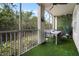 Private balcony with artificial turf and outdoor furniture at 4990 Baraldi Cir # 101, Sarasota, FL 34235