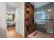 Bathroom with walk-in shower and built-in shelves at 4990 Baraldi Cir # 101, Sarasota, FL 34235