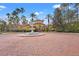 Community center with a fountain and palm trees at 4990 Baraldi Cir # 101, Sarasota, FL 34235