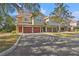 Row of townhomes with attached garages and landscaping at 4990 Baraldi Cir # 101, Sarasota, FL 34235