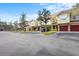 Several tan townhomes with attached garages at 4990 Baraldi Cir # 101, Sarasota, FL 34235