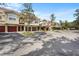 Row of tan townhomes with red garage doors at 4990 Baraldi Cir # 101, Sarasota, FL 34235