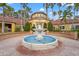 Community center fountain with a yellow building in the background at 4990 Baraldi Cir # 101, Sarasota, FL 34235