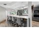 Modern kitchen with gray cabinetry and island at 4990 Baraldi Cir # 101, Sarasota, FL 34235