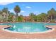 Relaxing community pool area with surrounding landscaping at 4990 Baraldi Cir # 101, Sarasota, FL 34235