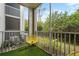 Private screened balcony overlooking lush greenery at 4990 Baraldi Cir # 101, Sarasota, FL 34235