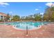 Relaxing community pool with lounge chairs at 4990 Baraldi Cir # 101, Sarasota, FL 34235