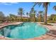 Inviting community pool with lounge chairs and lush landscaping at 4990 Baraldi Cir # 101, Sarasota, FL 34235