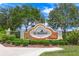 Community entrance with a welcoming sign and landscaping at 521 Luminary Blvd, Osprey, FL 34229