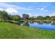 Scenic view of a tranquil lake with lush green landscape at 521 Luminary Blvd, Osprey, FL 34229