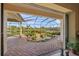 Screened patio with pond and waterfall features at 521 Luminary Blvd, Osprey, FL 34229